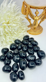 Black Obsidian tumbled stone with glossy finish — crystal of protection, truth, and deep transformation.