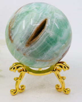 Tidal Sanctuary Caribbean Calcite sphere 276g with seafoam aqua banding Aragonite formations and natural cavity