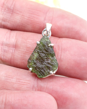 Genuine Czech Moldavite pendant in .925 sterling silver claw setting featuring natural green Moldavite from the Czech Republic.