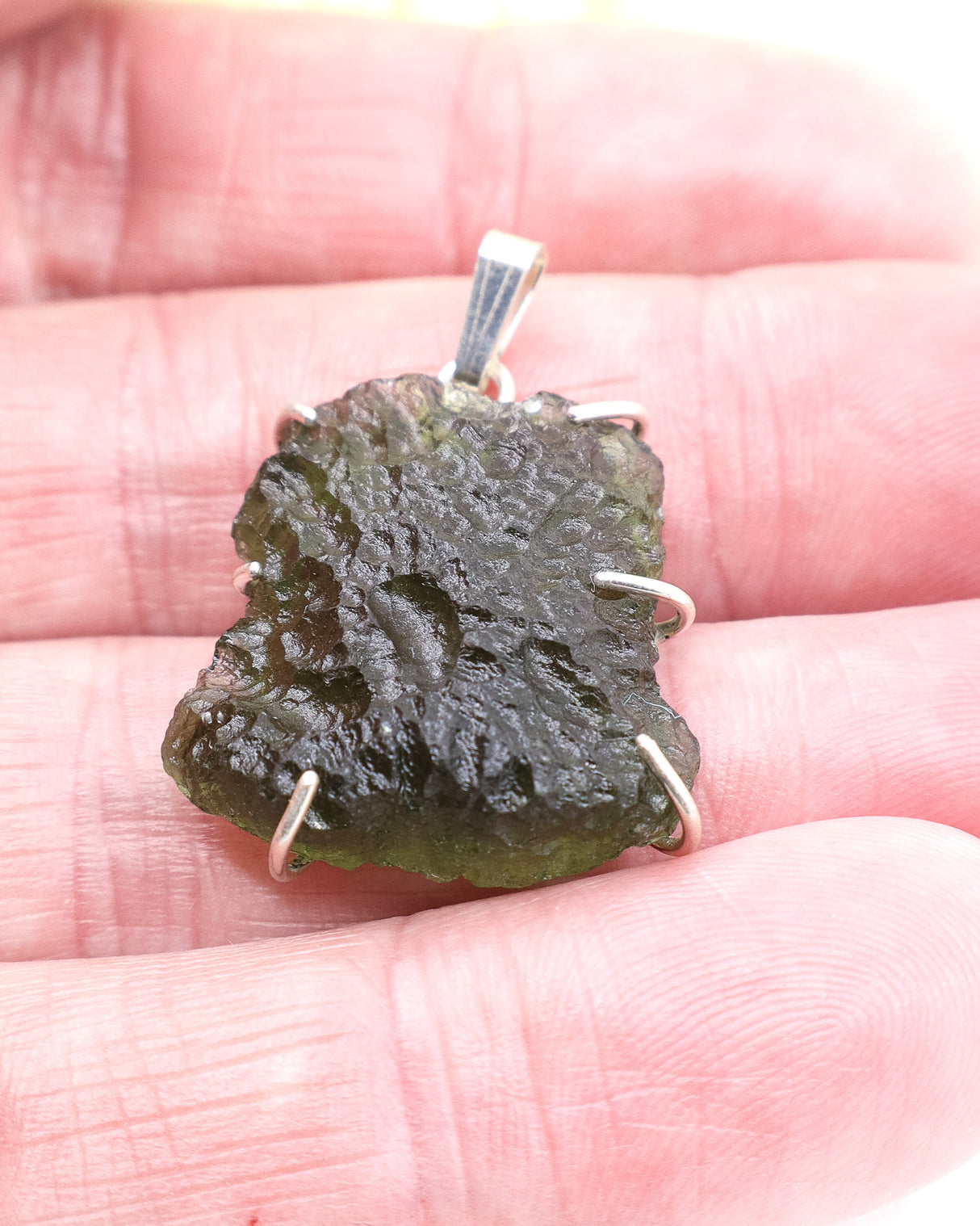 Large genuine Czech Moldavite pendant in .925 sterling silver featuring natural textured Moldavite from the Czech Republic associated with Starseed awakening and soul purpose.