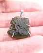 Large genuine Czech Moldavite pendant in .925 sterling silver featuring natural textured Moldavite from the Czech Republic associated with Starseed awakening and soul purpose.