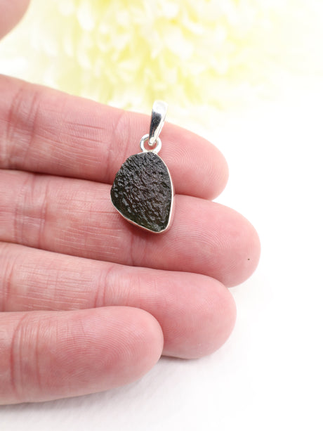 Genuine Czech Moldavite pendant set in .925 sterling silver featuring natural texture, deep green colouring and powerful transformational energy.
