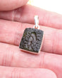 Genuine Czech Moldavite pendant in .925 sterling silver featuring a rare portal-like natural formation, deep green colouring and powerful spiritual awakening energy.