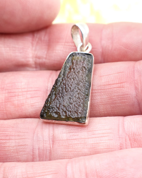 Genuine Czech Moldavite pendant in .925 sterling silver featuring natural etched texture, olive-green colouring and powerful transformational energy.