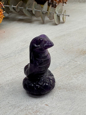 Chevron Amethyst Snake Carving 4 cm × 3 cm – purple and white banded crystal snake symbolising transformation, healing and spiritual awakening, Inspired By 3 Australia.