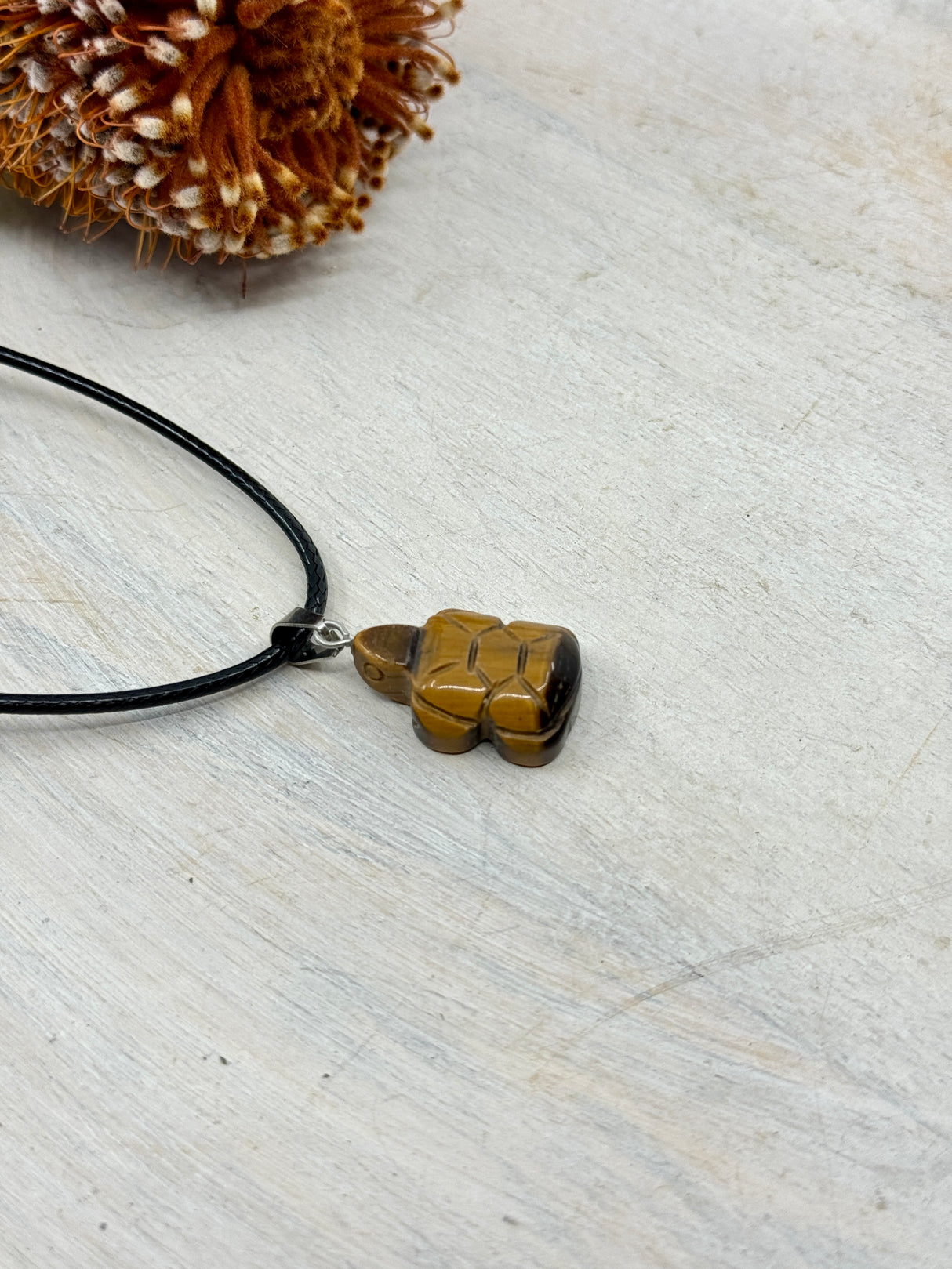 Tiger Eye turtle pendant 26x15x6mm stainless steel finding – brown and gold crystal carving for protection, strength and grounding – Inspired By 3 Crystals Australia.