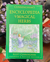 Cunningham’s Encyclopedia of Magical Herbs by Scott Cunningham featuring green cover artwork and expanded revised edition subtitle.