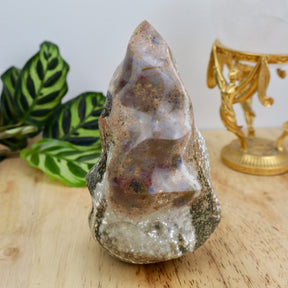 969g Ocean Jasper flame crystal measuring 15cm x 9cm with green, cream and earthy patterning displayed on wooden surface.