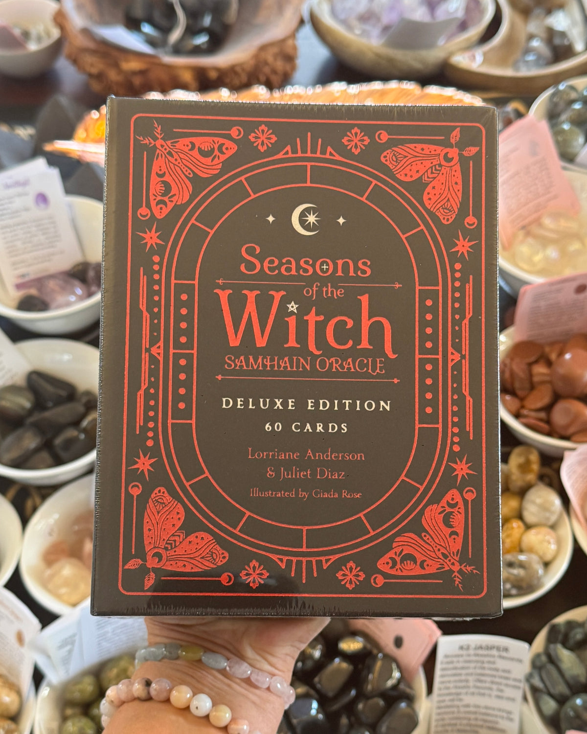 Seasons of the Witch Samhain Oracle Deluxe Edition 60 card deck by Lorraine Anderson and Juliet Diaz, Rockpool Publishing, black and red witchcraft oracle cards for ancestral wisdom, divination, shadow work and spiritual rituals.
