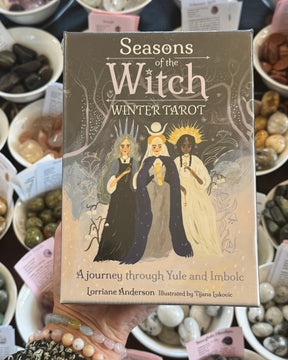Seasons of the Witch Winter Tarot 78 card deck by Lorraine Anderson, illustrated by Tijana Lukovic, magical Yule and Imbolc witchcraft tarot cards with winter goddesses and mystical seasonal artwork.