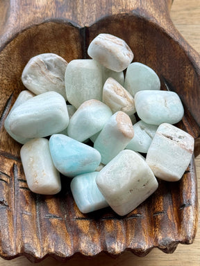 Caribbean Blue Calcite tumbled stone with ocean-blue and sand-brown tones — crystal of tranquility, awakening, and dreamy flow.