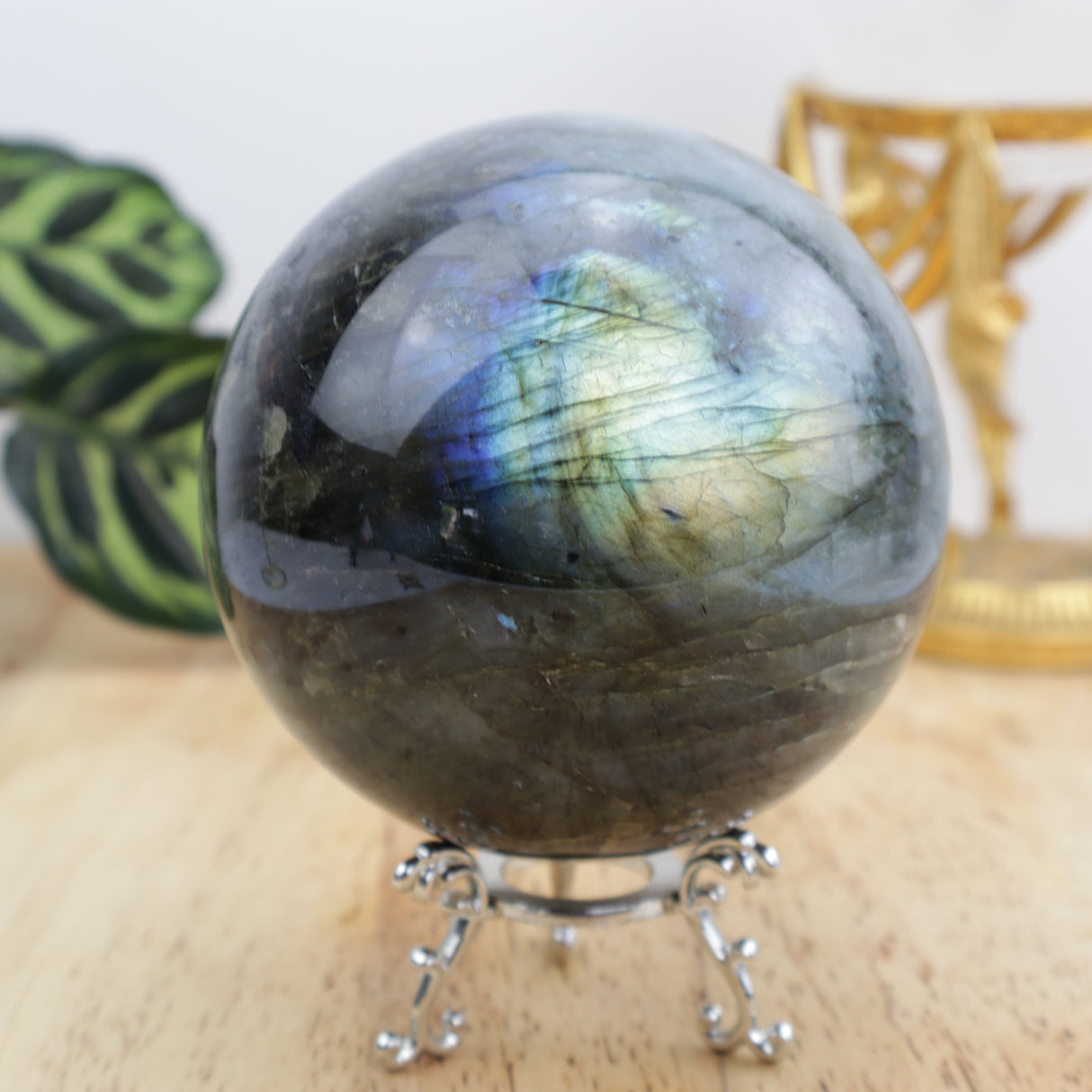 Labradorite sphere 1.239kg with blue flash on decorative stand
