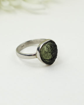 Genuine Czech Moldavite sterling silver ring featuring a natural freeform teardrop raw Moldavite gemstone in a handcrafted bezel setting, Size 7.