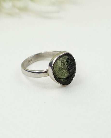 Genuine Czech Moldavite sterling silver ring featuring a natural freeform teardrop raw Moldavite gemstone in a handcrafted bezel setting, Size 7.