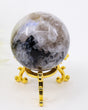 205g Rainbow Moonstone Sphere with natural blue flash, silvery white feldspar crystals and black inclusions, polished into a premium crystal sphere.
