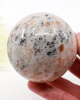 Natural Sunstone Sphere with Black Tourmaline Inclusions 699g – 8.5cm | Joy, Protection & Personal Power Crystal