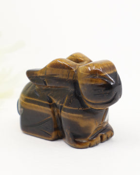 Tiger Eye rabbit crystal carving with golden brown natural banding and polished finish