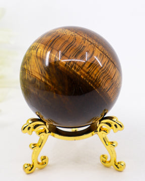 195g Tiger Eye Gold Sphere with rich golden chatoyancy displaying natural bands of golden brown and deep chocolate tones on a polished crystal sphere.