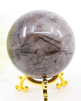 Premium 319g Black Tourmalinated Quartz crystal sphere with natural black Tourmaline inclusions and display stand.