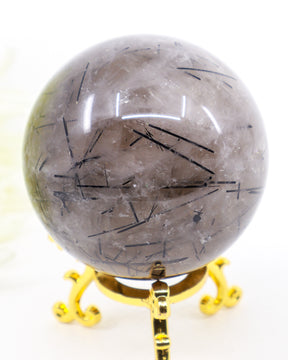 Premium 319g Black Tourmalinated Quartz crystal sphere with natural black Tourmaline inclusions and display stand.