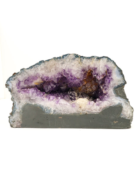 Large 8.2kg Amethyst Cave with Calcite inclusions featuring deep purple crystal formations, natural agate banding and sparkling geode cavity.