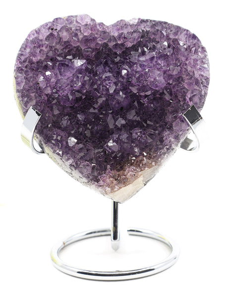 Natural Amethyst Crystal Heart with deep purple druzy crystal formations displayed on a metal stand associated with love, emotional healing, inner peace and spiritual wisdom.