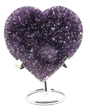 Deep purple Amethyst Crystal Heart with sparkling druzy crystal formations displayed on a metal stand associated with spiritual wisdom, emotional healing and unconditional love.