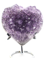 Lavender Amethyst Crystal Heart with sparkling druzy crystal formations displayed on a metal stand associated with peace, emotional healing and spiritual wisdom.