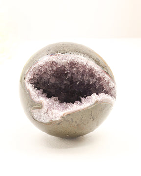 Natural Amethyst Cluster Sphere 614g with sparkling crystal cave opening, druzy crystals and polished outer shell displaying soft purple Amethyst formations.