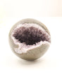 Natural Amethyst Cluster Sphere 614g with sparkling crystal cave opening, druzy crystals and polished outer shell displaying soft purple Amethyst formations.