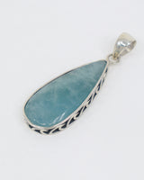 Natural Aquamarine sterling silver pendant with soft ocean blue elongated teardrop gemstone, decorative .925 silver setting and complimentary snake chain.