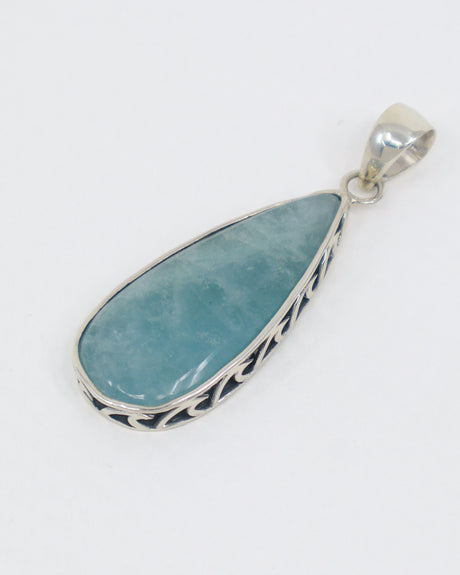 Natural Aquamarine sterling silver pendant with soft ocean blue elongated teardrop gemstone, decorative .925 silver setting and complimentary snake chain.