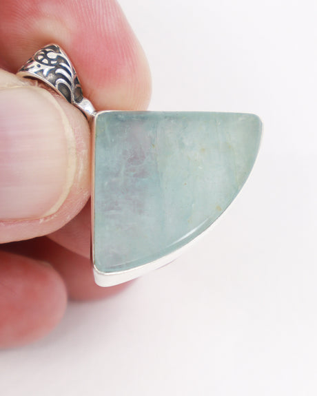 Natural Aquamarine sterling silver pendant with pale sea blue-green gemstone, fan-shaped crystal and ornate silver bail, Aquamarine jewellery Australia.
