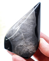 Black Banded Agate Flame 141g with glossy black bands and smoky grey crystalline centre, polished 8.5cm protection and grounding crystal.