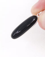 Black Onyx sterling silver pendant with elongated polished black gemstone set in .925 silver, grounding and protection crystal jewellery.