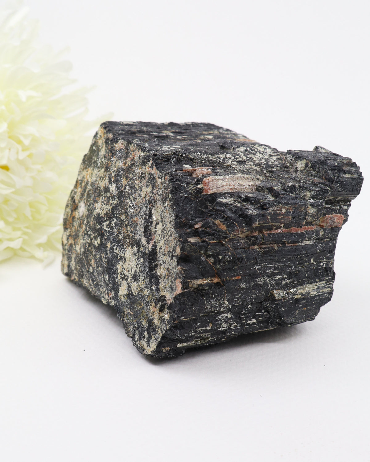 Large raw Black Tourmaline with Pink Feldspar specimen 1.242kg featuring natural black striated Tourmaline crystals and salmon pink mineral veins.