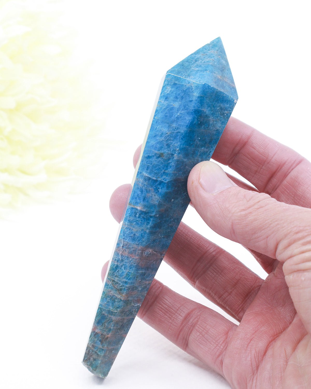 Natural Blue Apatite crystal wand 180g with deep ocean blue colouring, natural mineral banding and gold display stand.