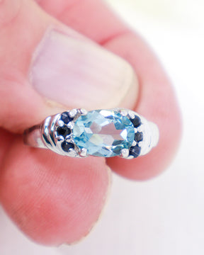 Blue Topaz and Black Spinel sterling silver ring size 7 with oval faceted natural Blue Topaz gemstone and black Spinel accent stones.