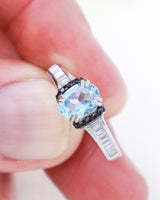 Blue Topaz Black Spinel and Cubic Zirconia sterling silver ring Size 9 with faceted oval natural Blue Topaz gemstone and sparkling CZ band.