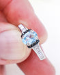 Blue Topaz Black Spinel and Cubic Zirconia sterling silver ring Size 9 with faceted oval natural Blue Topaz gemstone and sparkling CZ band.