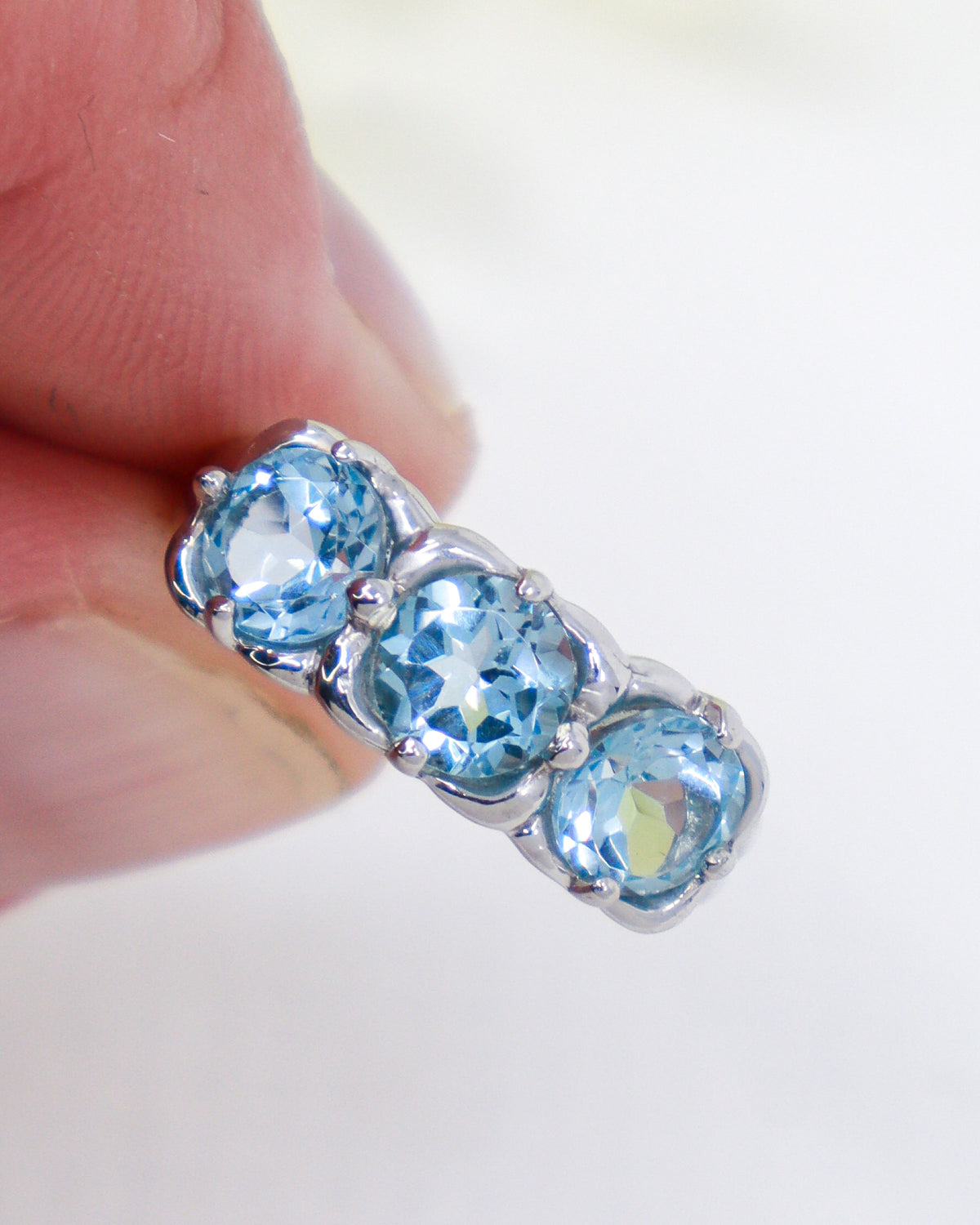 Natural Blue Topaz three stone sterling silver ring Size 7 with three faceted oval blue gemstones in .925 silver.