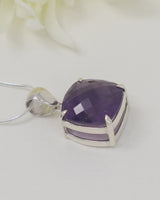 High quality faceted Brazilian Amethyst cushion pendant in 0.925 sterling silver with complimentary silver snake chain.