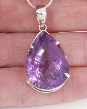 High quality Brazilian Amethyst teardrop pendant in 0.925 sterling silver with faceted violet gemstone and complimentary silver snake chain.