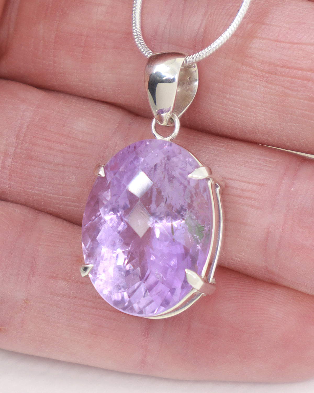 Brazilian Amethyst oval pendant in .925 sterling silver with faceted lavender purple crystal
