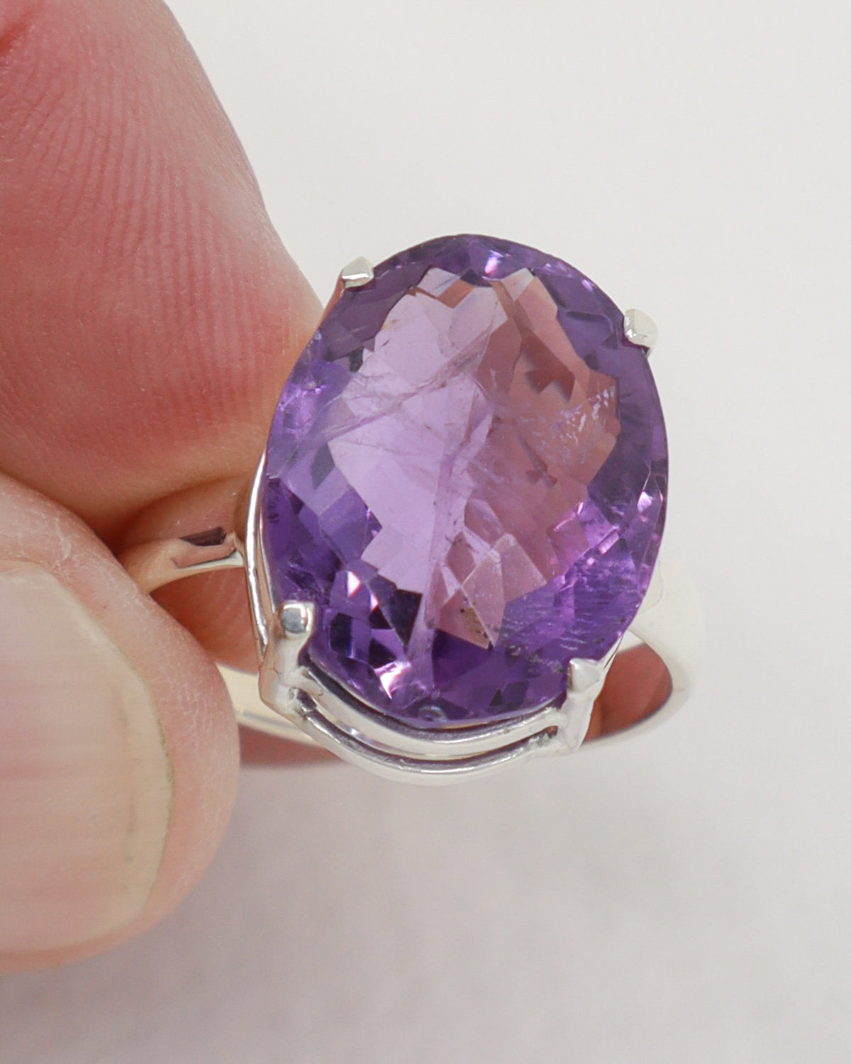 Brazilian Amethyst statement ring size 9 with large oval faceted purple gemstone set in .925 sterling silver.