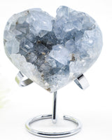 Celestite Crystal Heart on silver stand featuring sparkling pale blue crystal points and natural druzy formations, weighing 801g.