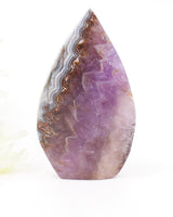 Polished Chevron Amethyst freeform featuring intricate natural banding, lavender Amethyst and layered Quartz formations associated with intuition and spiritual awareness.