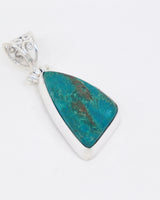Natural Chrysocolla sterling silver pendant with vibrant turquoise blue-green stone, earthy brown matrix and ornate silver scrollwork bail.