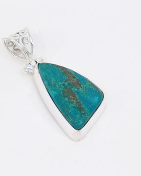 Natural Chrysocolla sterling silver pendant with vibrant turquoise blue-green stone, earthy brown matrix and ornate silver scrollwork bail.