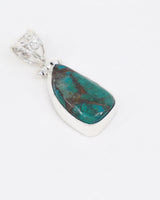 Natural Chrysocolla sterling silver pendant with turquoise teal green and earthy brown matrix, elongated teardrop crystal and ornate silver bail.